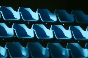 a row of blue chairs photo