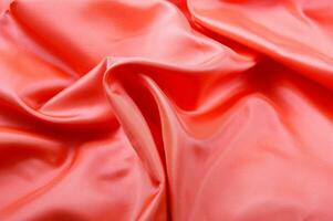 a close up of a bright pink satin fabric photo