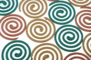 a group of colorful coasters with a spiral design photo