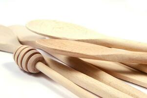 a group of wooden spoons sitting on a white surface photo