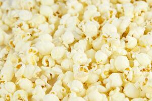 four colorful bowls of popcorn on a white surface photo