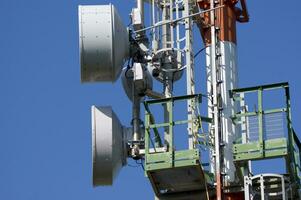 a cell phone tower with two antennas photo