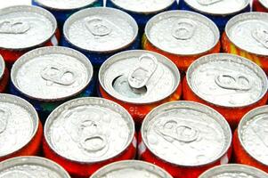 a close up of cans of soda photo