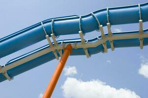 a blue slide in a water park photo