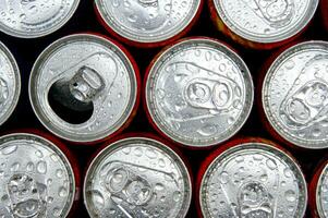 a close up of cans of soda photo