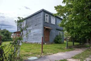 example of hundred-year-old historical building and homestead of private sector in wooden constructivism style photo