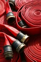 a close up of a red fire hose photo