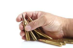 a row of bullet cartridges on a white background photo