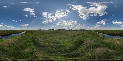 spherical 360 hdri panorama among green grass farming field near melioration reclamation canal in equirectangular seamless projection, as sky dome replacement, game development as skybox or VR content photo