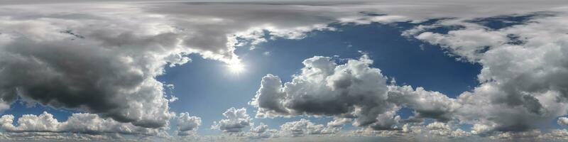 360 hdri panorama of blue overcast skydome with cumulus clouds, seamless sky panorama view with zenith for use in 3d graphics or game development or edit drone shot photo