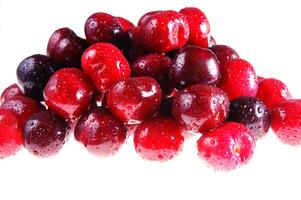 a close up of a bowl of cherries photo