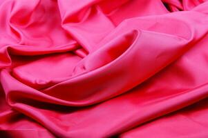 a close up of a red satin fabric photo
