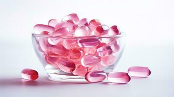 Pink transparent vitamins on a light background photo