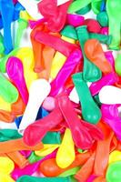 a pile of colorful plastic balloons photo