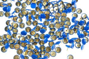 a pile of blue and gold buttons photo