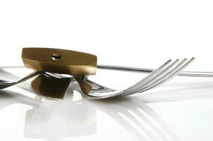 a fork, knife and spoon are arranged in a holder photo