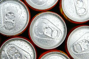 a close up of cans of soda photo