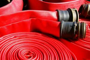 a pile of red fire hoses photo