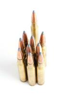 a row of bullet cartridges on a white background photo