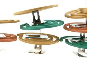 a group of colorful coasters with a spiral design photo