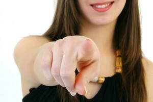 a woman pointing at something photo