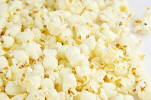 four colorful bowls of popcorn on a white surface photo