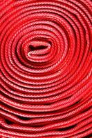 a close up of a red fire hose photo