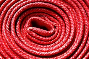 a close up of a red fire hose photo