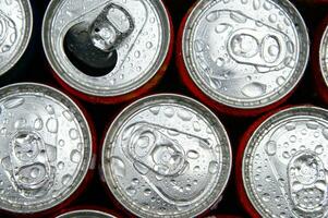 a close up of cans of soda photo