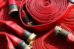 a close up of a red fire hose photo