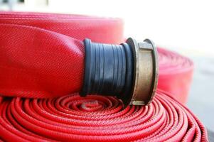 a close up of a red fire hose photo