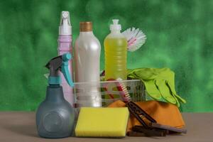 basket with cleaning products for home hygiene use photo