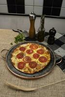 Neapolitan Brazilian pizza with mozzarella cheese and tomato slices with oregano photo
