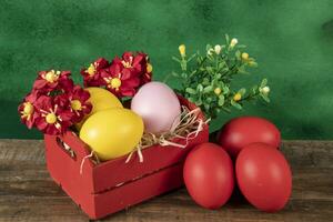 eggs in wooden box with hay on rustic background or surface, easter or holiday concept photo