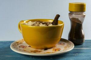 cup of canjica, typical food consumed in the Brazilian Festa Juninas photo