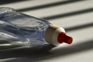 diet sweetener bottle on window light background photo