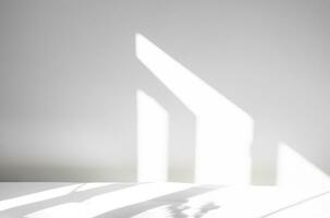 White Bedroom with Shadow leaves and Natural Bright Sunlight Shining Through Window on Cement Wall Texture and Cotton Bed Sheet, White and Grey with copy backdrop background banner photo