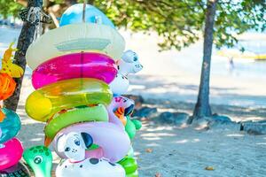 Cute Inflatable Ring on beach sand photo