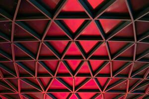 Abstract vortex architectural pattern of red triangles structure photo