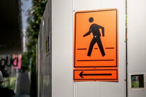 The pedestrian zone road sign with orange color photo
