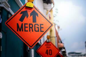 Merge way sign on the street photo