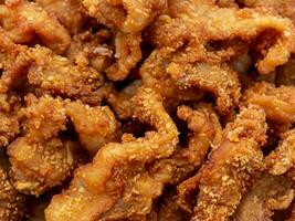 fried chicken wings on a black background. photo