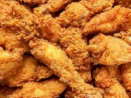 fried chicken wings on a black background. photo