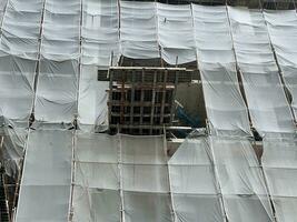 construction of an apartment building under a scaffolding. photo