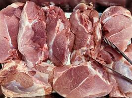 raw lamb meat on a butcher 's tray. photo