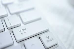 Hands of business woman Pressing enter button on computer keyboard photo