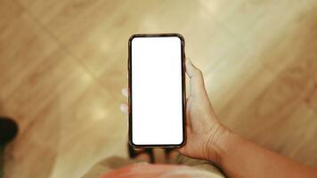 Women's hands holding cell telephone blank copy space screen. smartphone with blank white screen isolated on white background . smart phone with technology concept photo