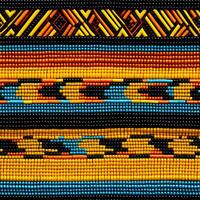 Colorful African Kente Cloth Fabric Background Displaying Traditional Tribal Patterns photo