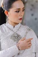 Beautiful Thai girl in Thai traditional costume.Bride Thai girl Beautiful. photo