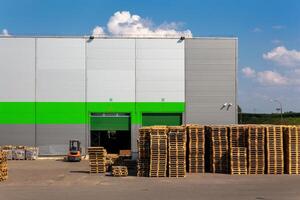 Wooden pallets heap in the cargo warehouse photo